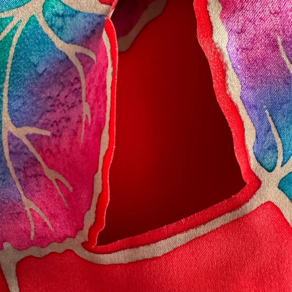 Kriska hand painted silk scarf. Red with multicolored leaves and cutouts. NWOT